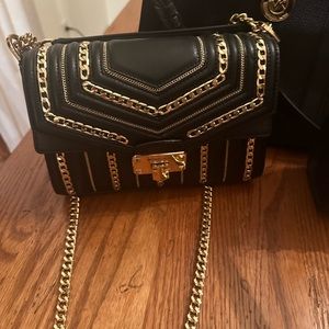 of holiday glitter!! Michael Kors black leather / gold metal chain detailing